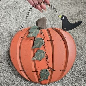 Rustic Orange Pumpkin Wall Decor with Green Leaves and Black Bird